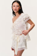 Ivory lace shorts with gathered waist bow and layered ruffle panels