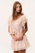 Petal peach silk ruffle top with lace ruffles at neckline and tiered skirt-style layers