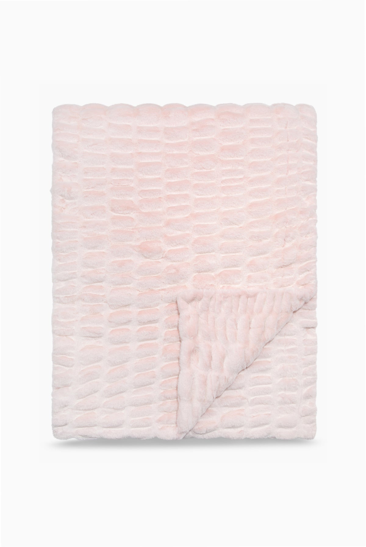 Folded throw blanket in petal pink textured with a soft, frosted finish