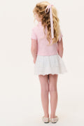 Girls' pink polo shirt back view with collar and short sleeves