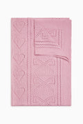 Pink pointelle throw blanket with geometric heart and star pattern