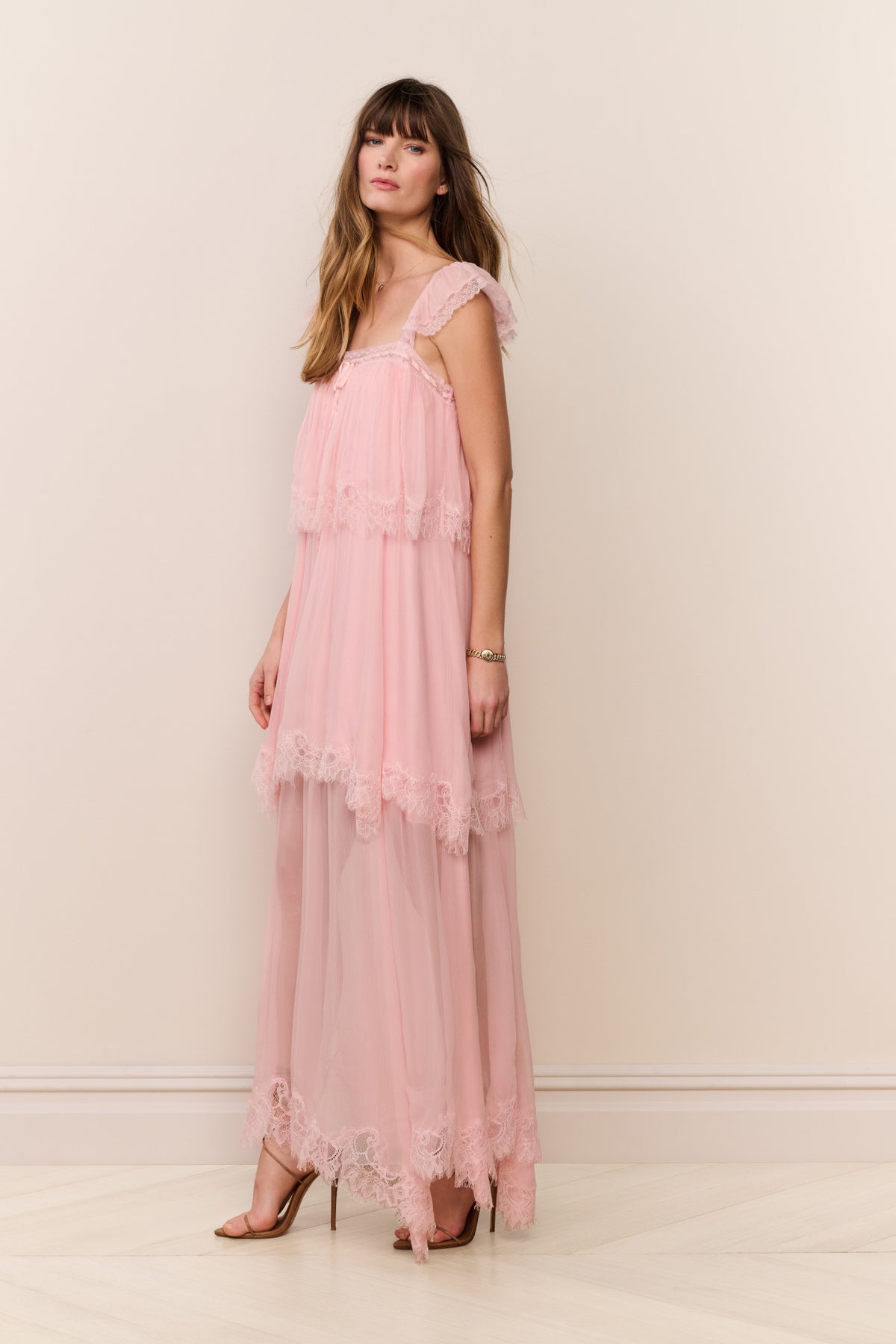 Pink silk chiffon maxi dress with square neckline, lace tiered details, and long skirt
