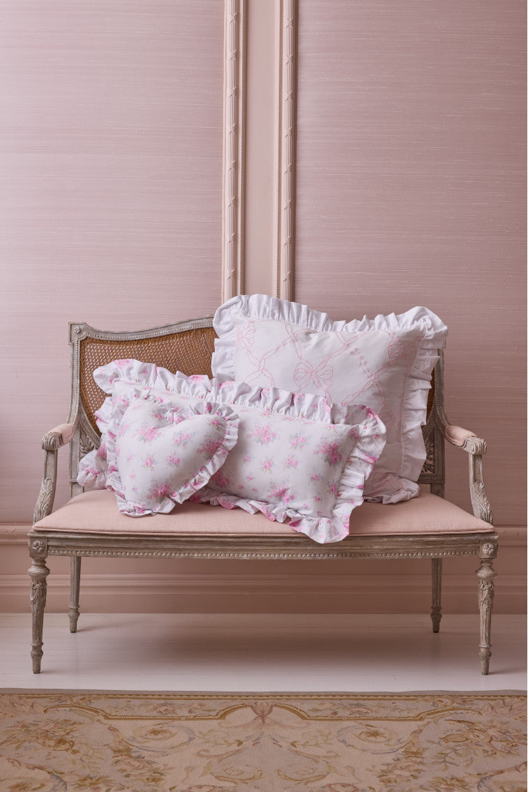 Rosewater embroidered euro pillow with white ruffle edge and lattice bow stitching