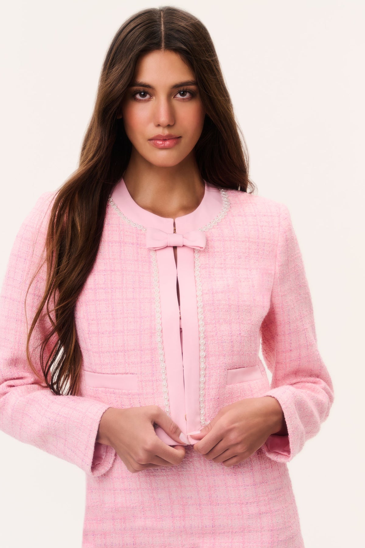 Pink tweed jacket with pearl detailing, open collar and front zip