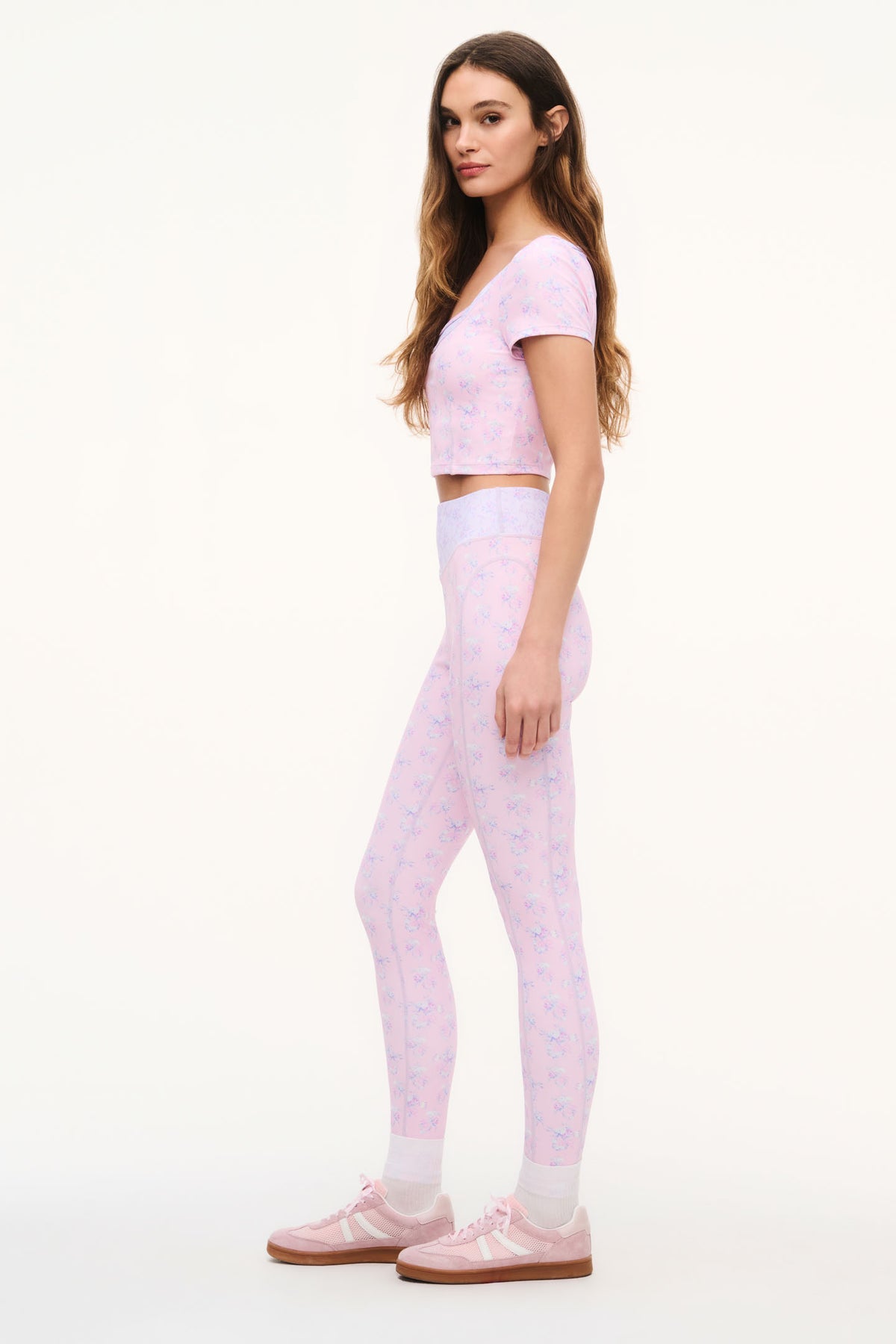 Lilac mixed-print active crop top in side view with scoop neck and short sleeves