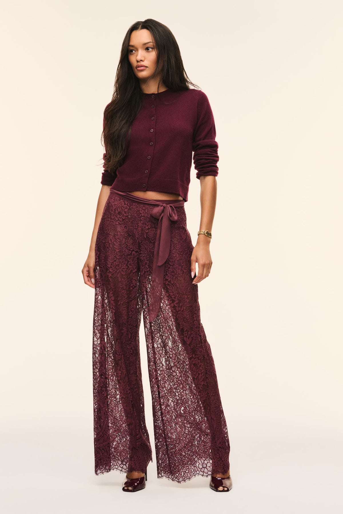 Faded merlot sheer lace wide-leg pants with bow-tied waist and draped fit.