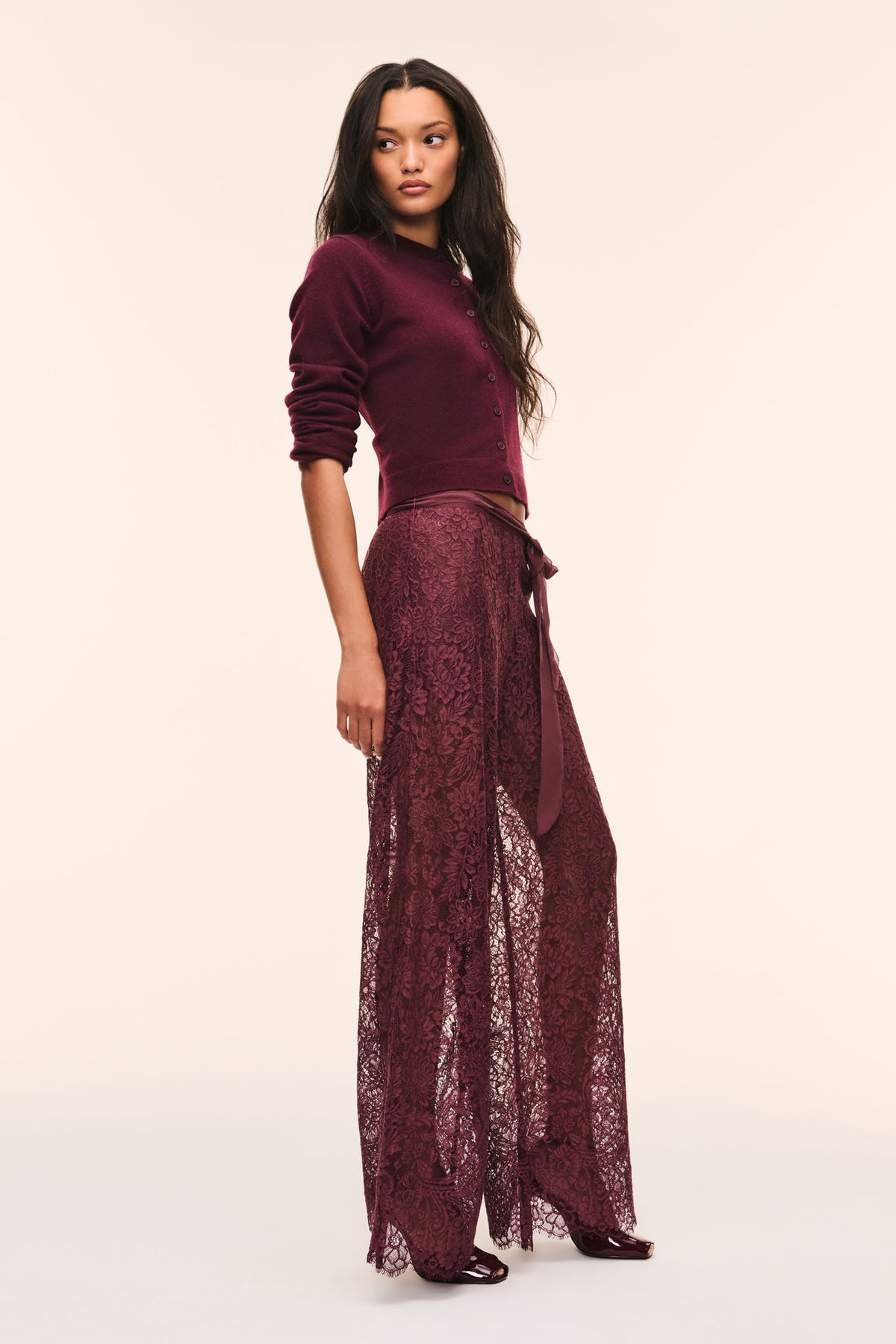 Faded merlot sheer lace pants with tie-front waist and wide flared legs.