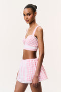 Pink-and-white mini skort with flared skirt and check panel detail