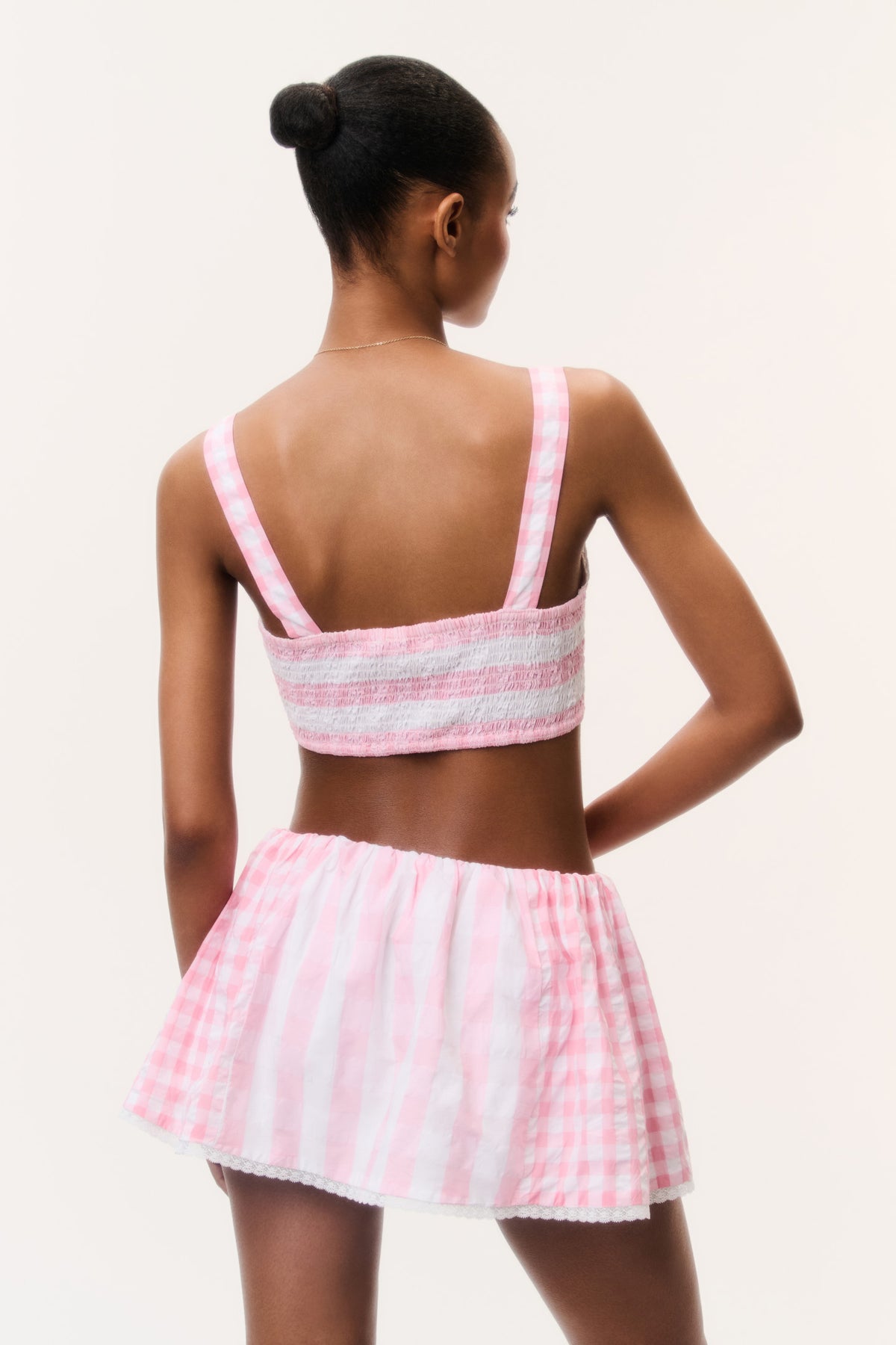 Pink seersucker bralette top with racerback straps, back view