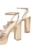 Champagne strappy platform sandals with block heels and ankle straps, side view