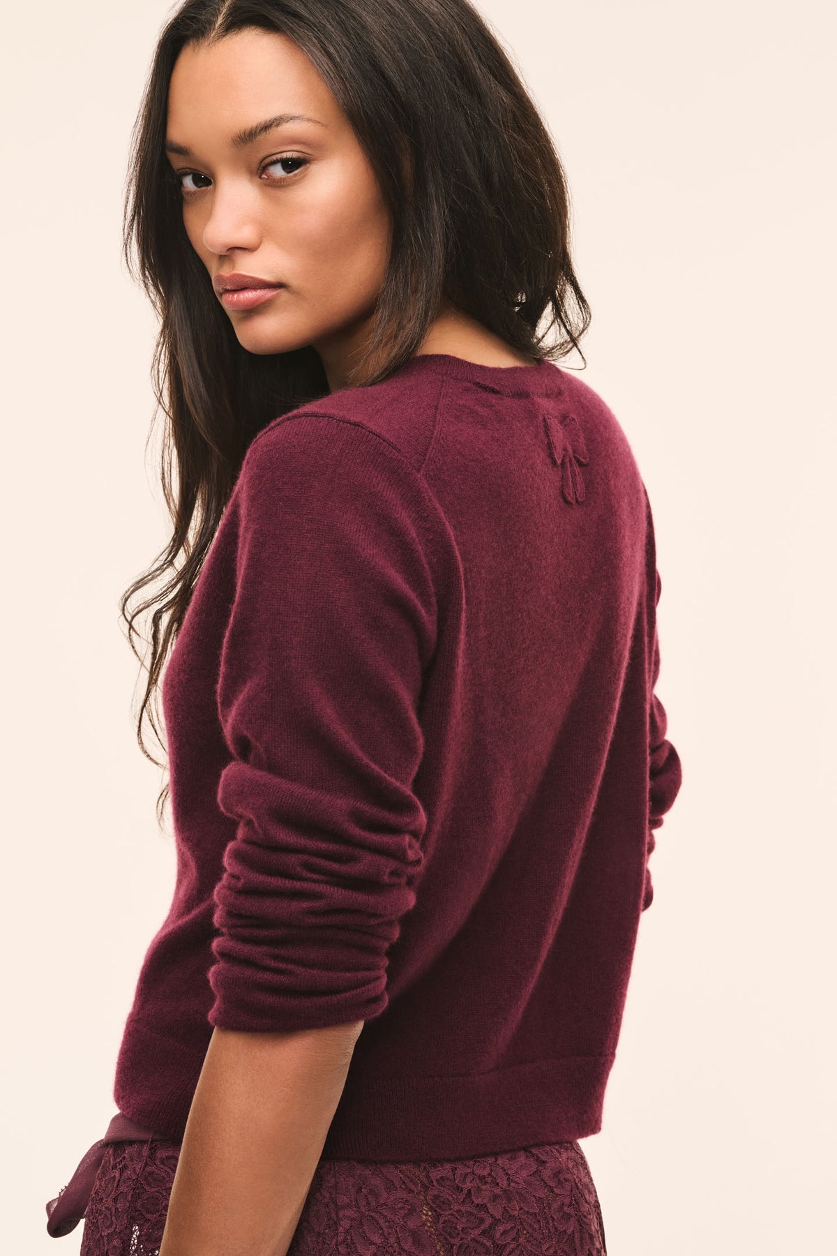 Burgundy cashmere cardigan with button front and long sleeves, back view