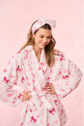 Light pink cotton bath robe with heart print and tied belt, V-neck front
