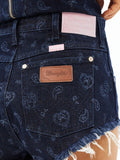 Denim micro shorts back pocket with Wrangler leather logo patch and pink tag