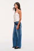 Wide-leg indigo jeans with black lace appliqué and high waist