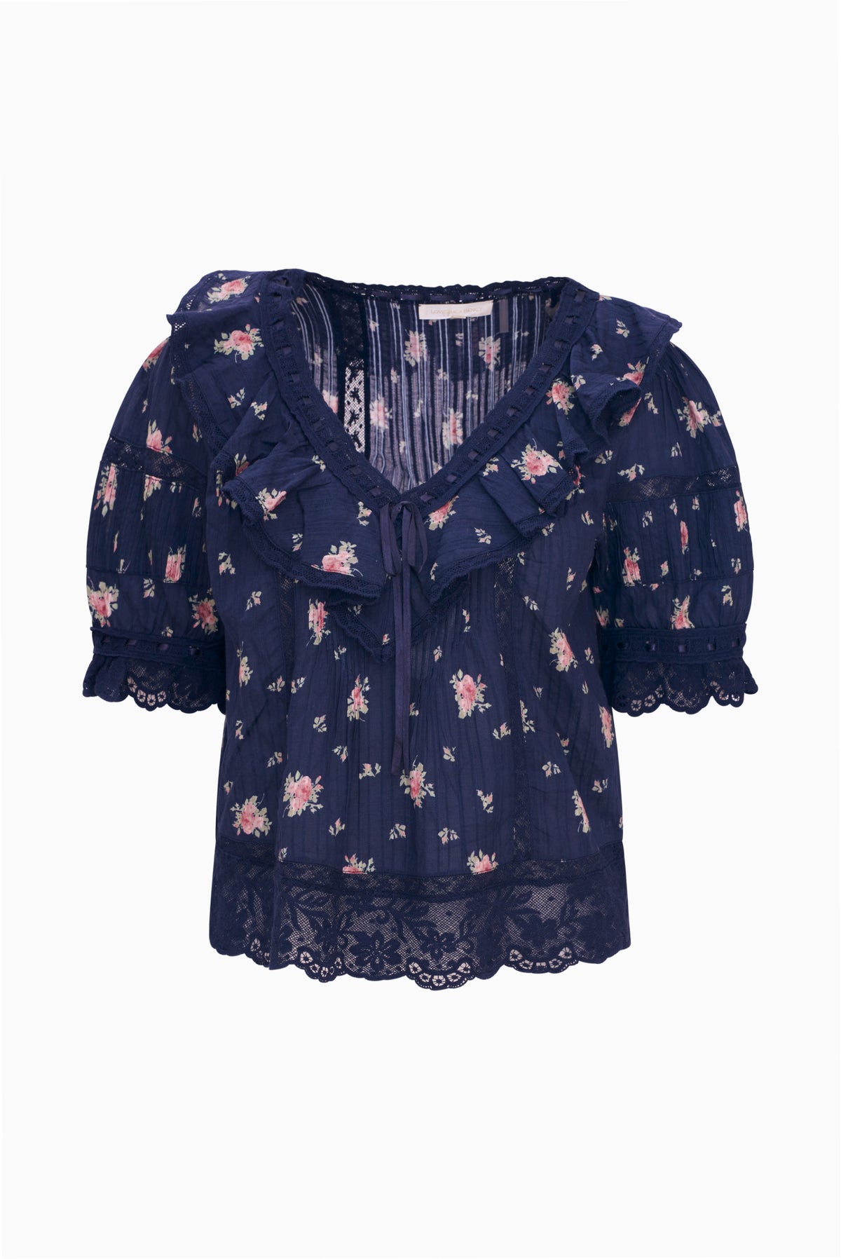 Navy floral cotton blouse with V-neckline, short puff sleeves, and lace-trim hem.