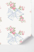 Peel-and-stick wallpaper with pastel blue ribbon bows and pink rose pattern
