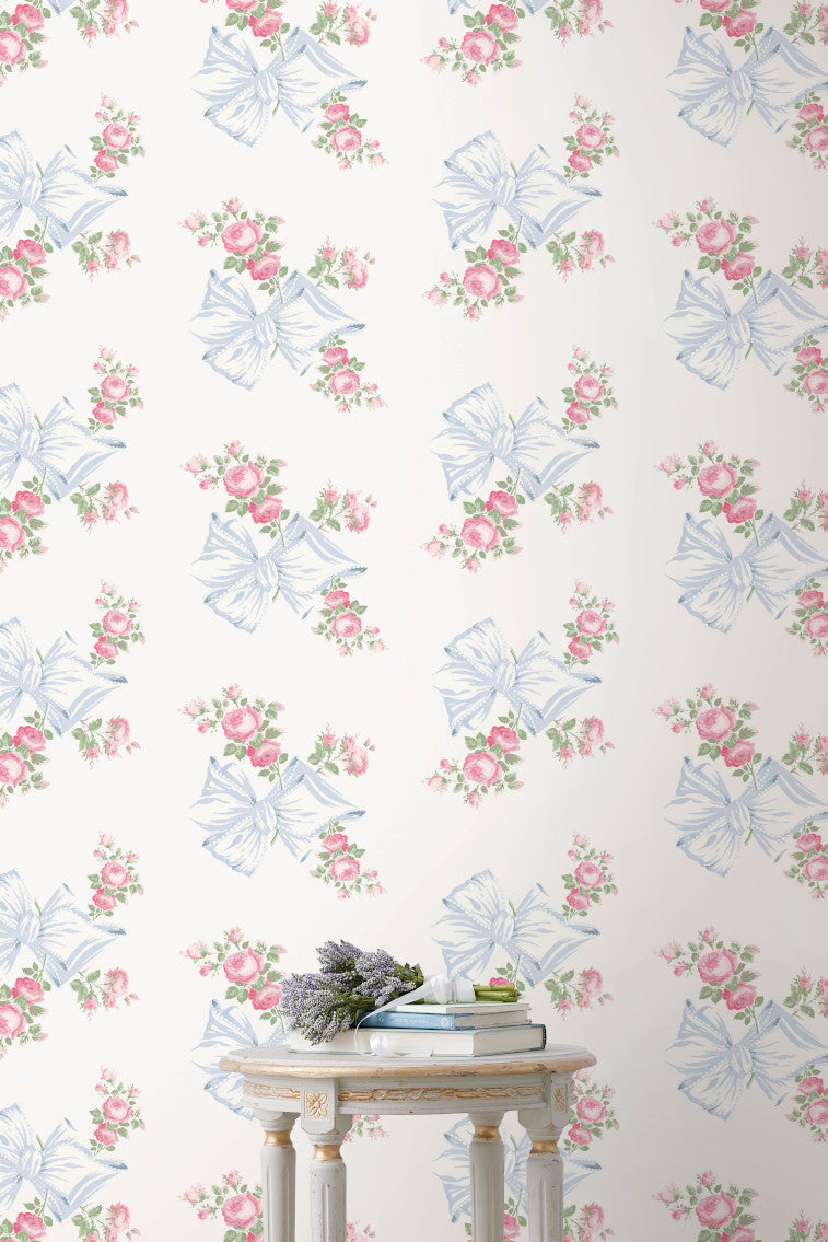 Peel-and-stick wallpaper sheet with pastel blue ribbon bows and pink rose repeat