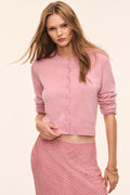 Soft pink cashmere cardigan with button front and round neckline