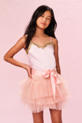 Tiered pink tulle skirt with satin bow at waistband and multiple ruffle layers