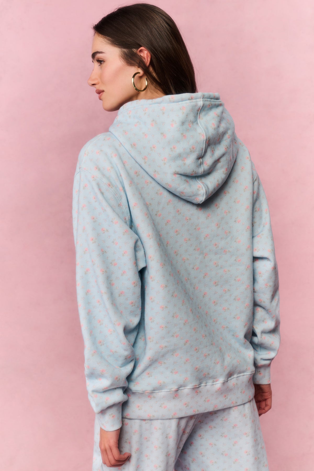 Light blue cotton hoodie with speckle print, pullover hood, and front kangaroo pocket