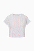 Light gray cropped tee with tiny scattered pattern, short sleeves, crew neckline