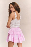 Pink tiered ruffle mini skirt with gathered waist and layered flounce tiers