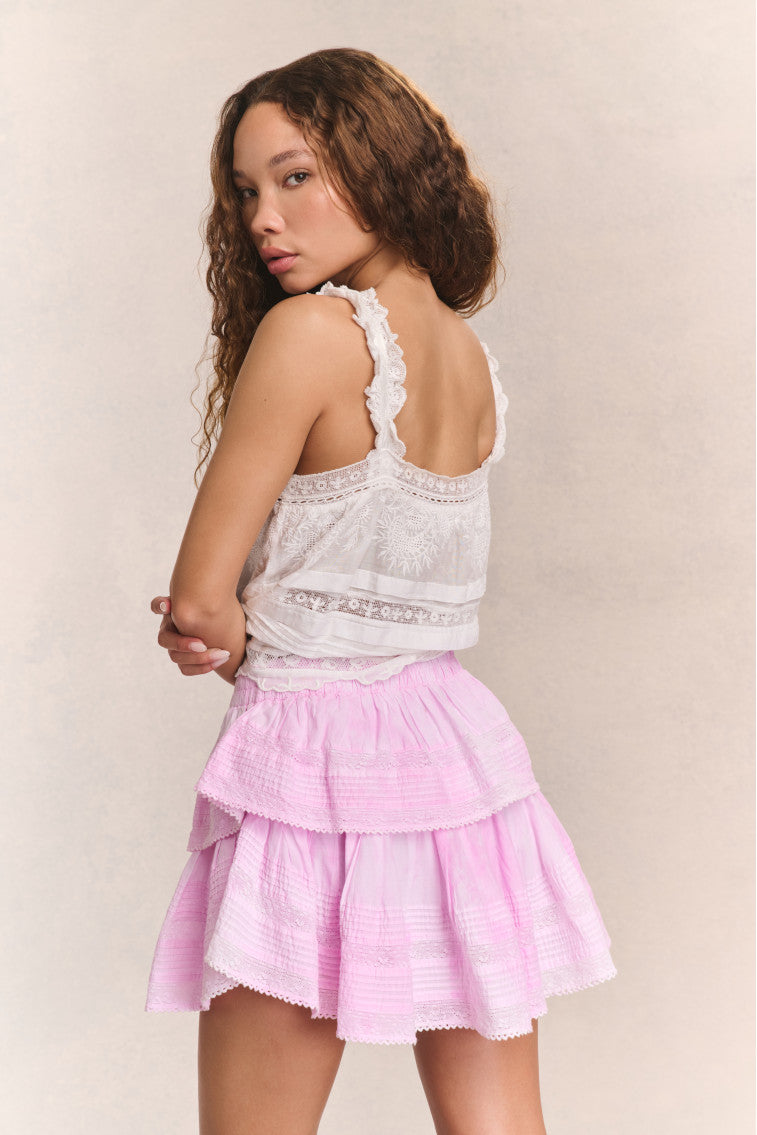 Pink tiered ruffle mini skirt with gathered waist and layered flounce tiers