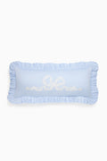 Light blue lumbar pillow with ruffled border and white floral motif