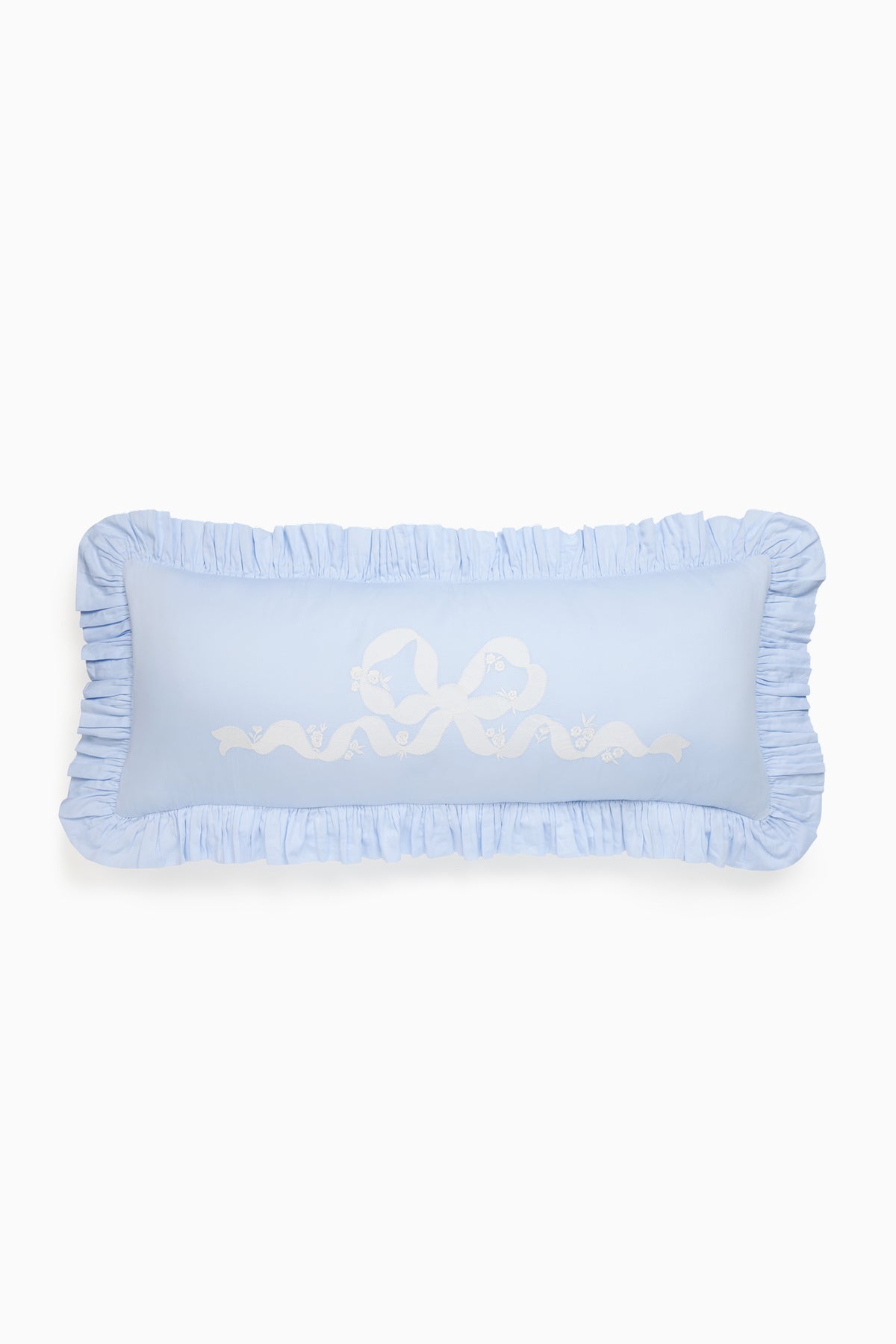 Light blue lumbar pillow with ruffled border and white floral motif