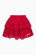 Crimson ruffle mini skirt with layered tiers and lace-trim hem.