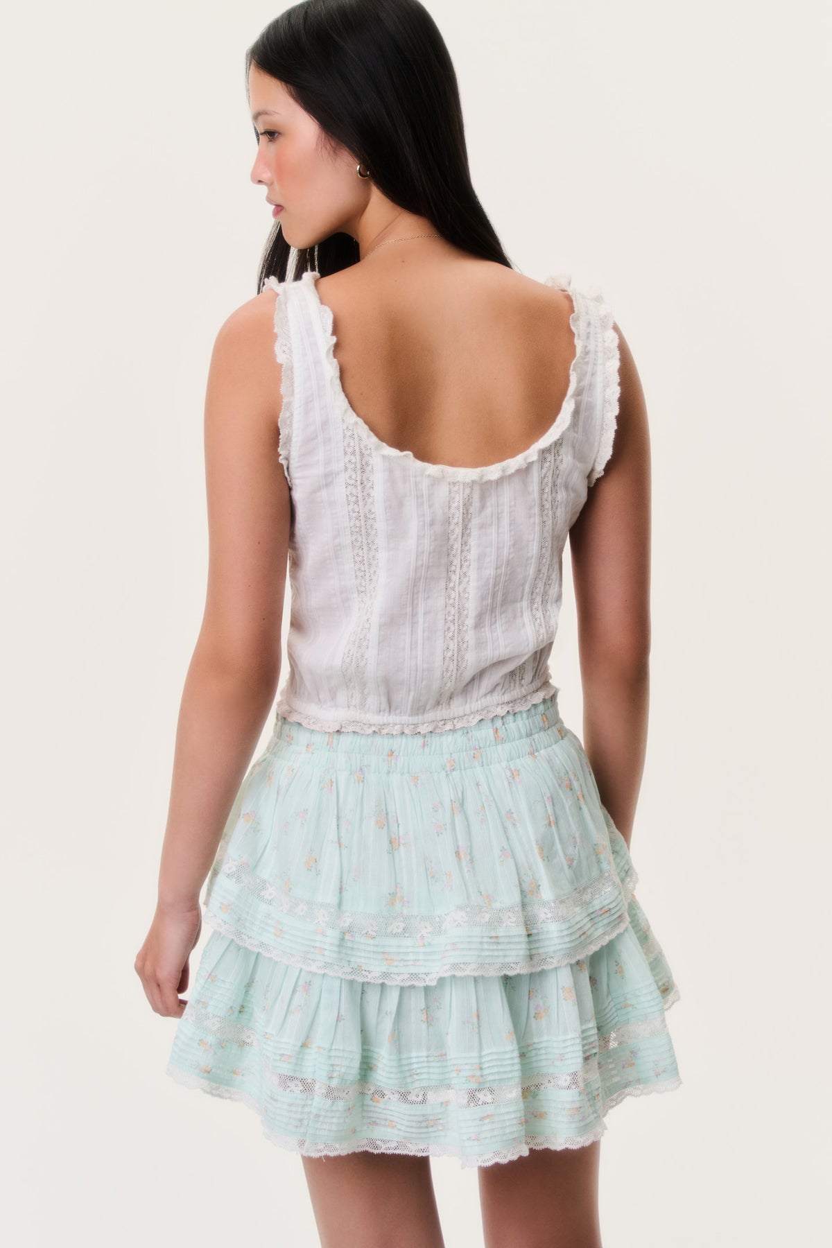 Celadon floral ruffle mini skirt, back view with tiered ruffles