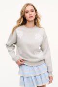 Light gray heather crewneck fleece sweatshirt with lace floral detailing on chest