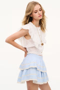 Chambray blue cotton tiered ruffle mini skirt with scalloped hem, side view