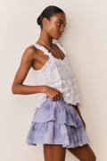 Hand-dyed tiered ruffle mini skirt, indigo ice blue wash, side view