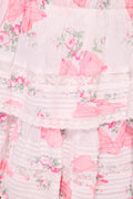 Floral print tiered ruffle mini skirt with pink accents on white