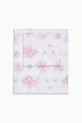 Pink floral sheet set folded flat, includes flat sheet and pillowcases