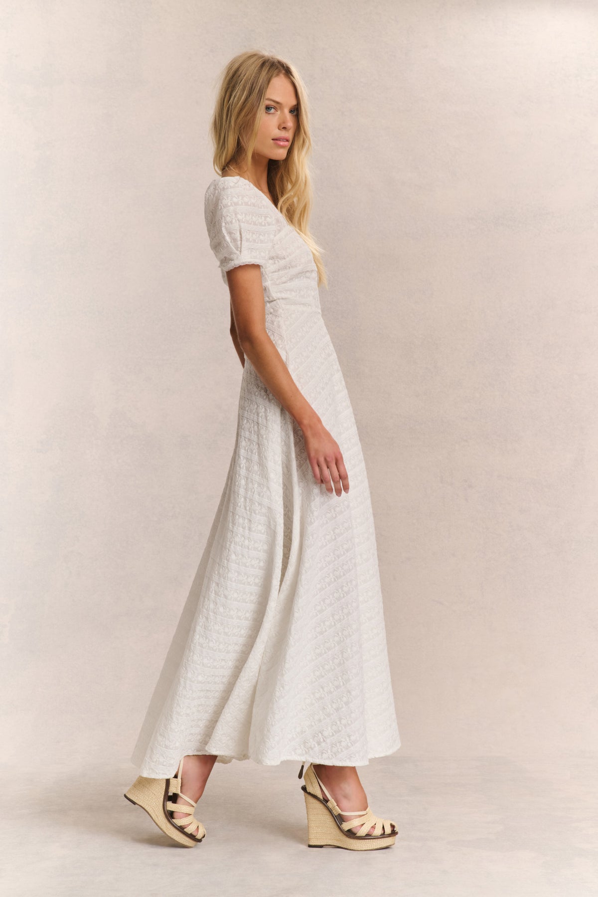 Ivory lace maxi dress with square neckline, short puff sleeves, flared skirt