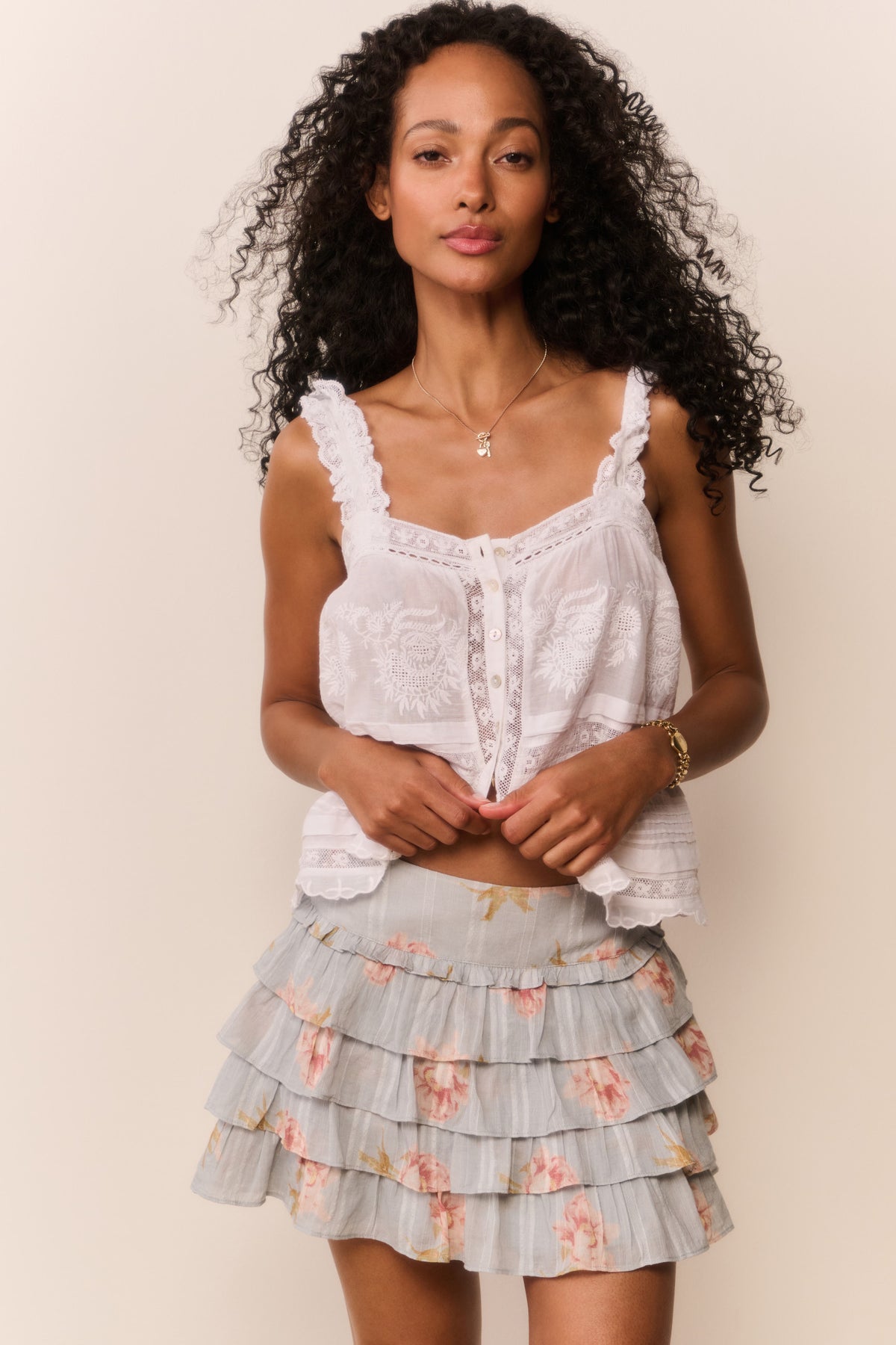 Layered ruffle mini skirt with light sky blue base and peony floral print