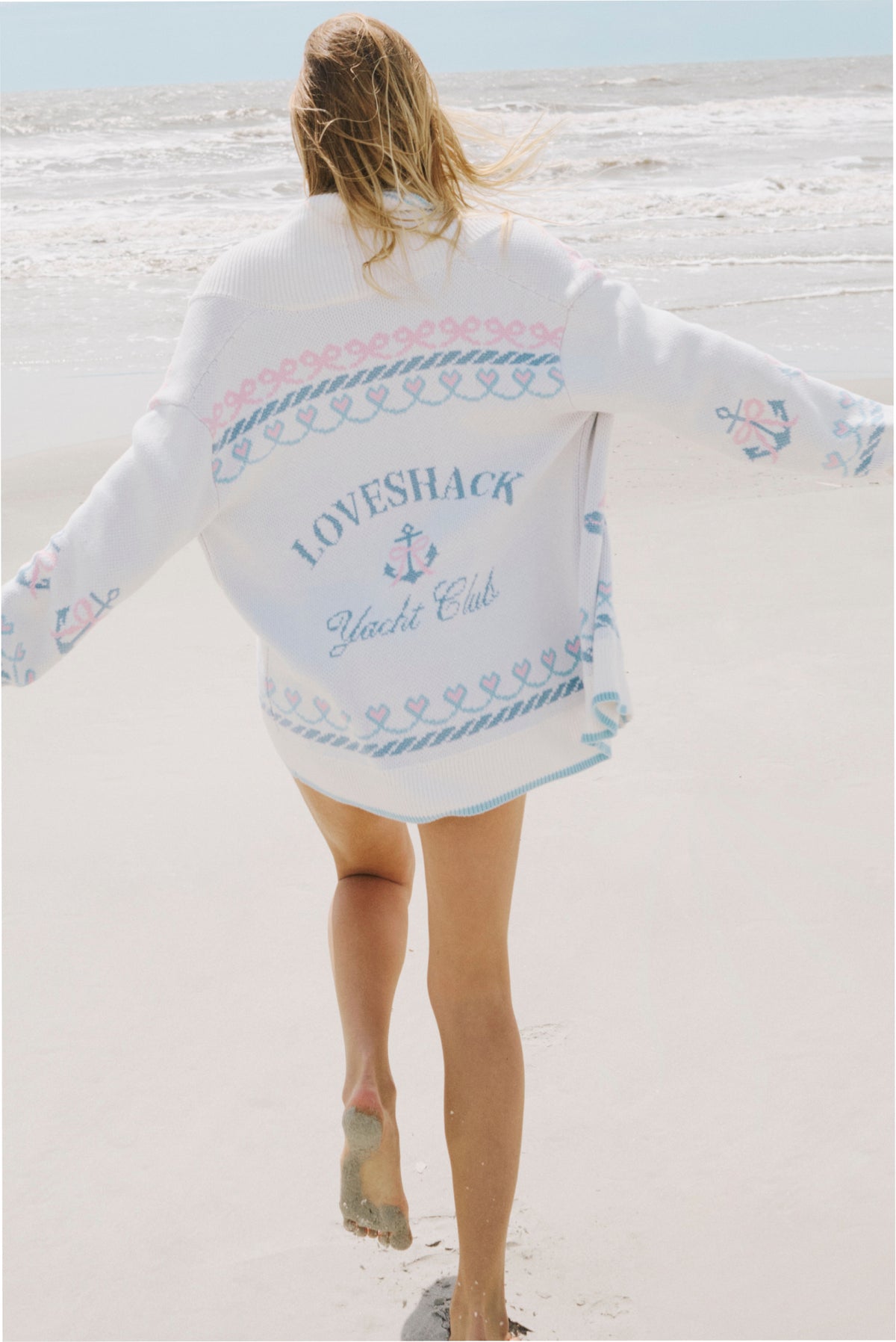 Light knit cardigan back with LOVESHACK Yacht Club text and anchor pattern, ribbed trim