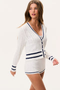 Ivory cable-knit V-neck cardigan with navy stripe bands and button front