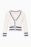 Ivory cable-knit cardigan with V-neck navy trim and button front