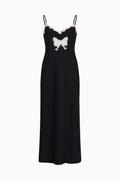 Black maxi dress with lace trim and bow applique on the front
