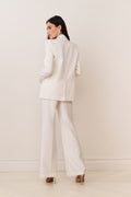 Cream wool-blend wide-leg trousers with tailored waistband and long straight drape