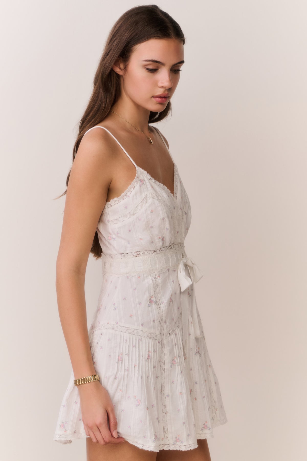 White floral embroidered cotton mini dress with V-neck and tie at waist