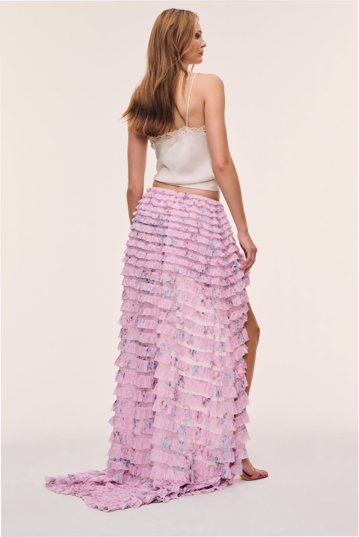 Soft wisteria tiered ruffle high-low skirt with cascading ruffles and high front hem.