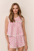 Pink heart-print sleeveless pajama top with tassel drawstring and matching shorts