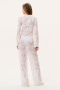 White sheer lace cover-up pants with wide legs and floral motifs, back view