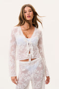 White sheer lace V-neck top with floral pattern and center tassel-tie
