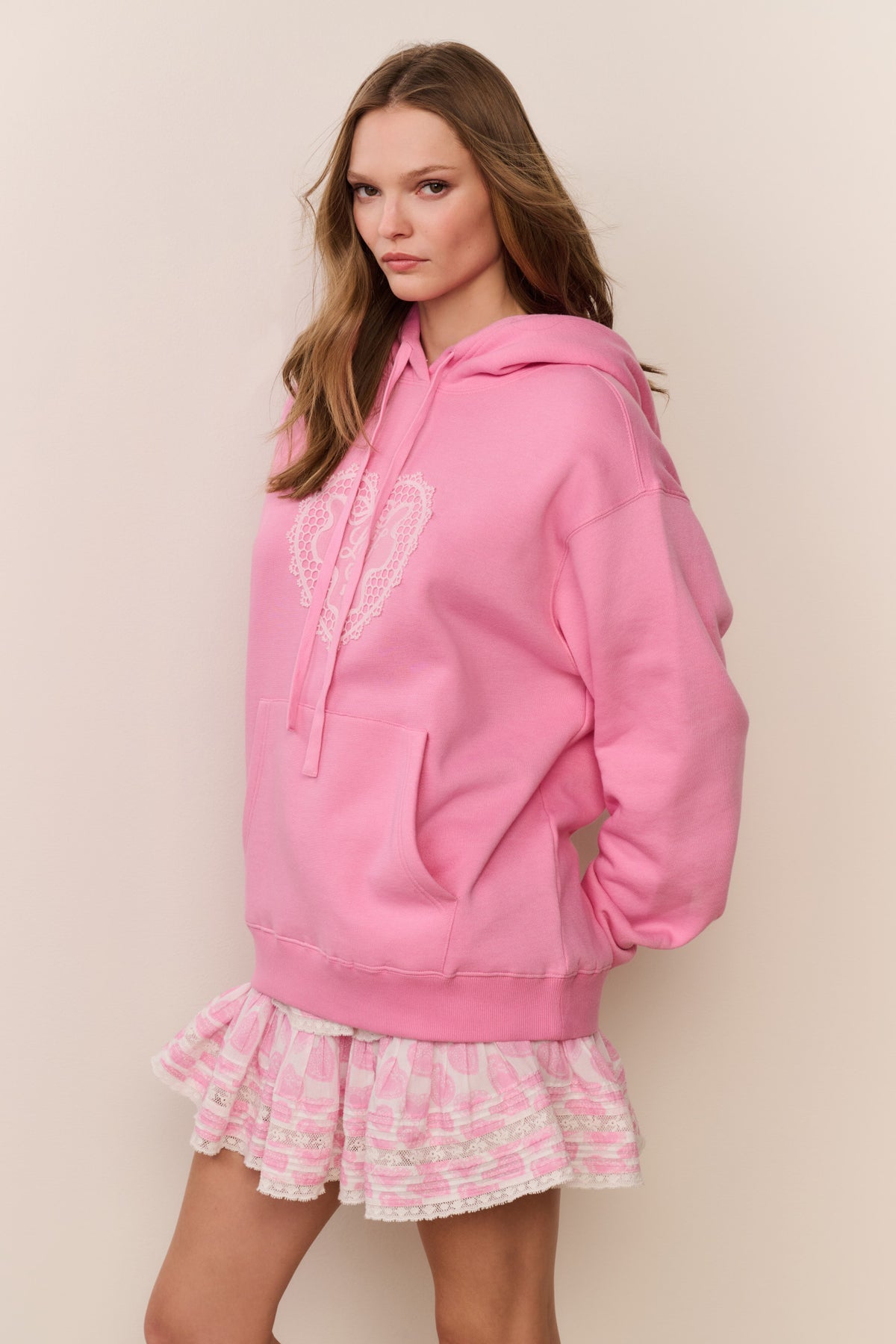 Pink fleece hoodie with heart applique on front, pullover hood, long sleeves