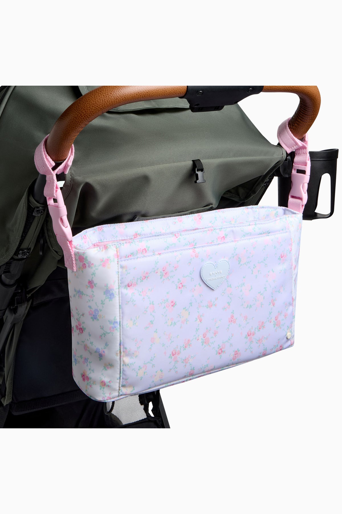 Floral stroller organizer attached to stroller with front zipper pocket